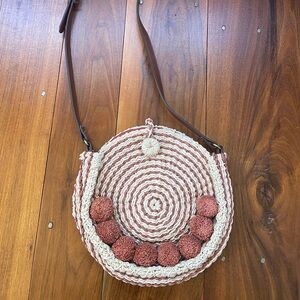 Fossil Faye baked clay round crossbody bag woven straw pom pom canteen
